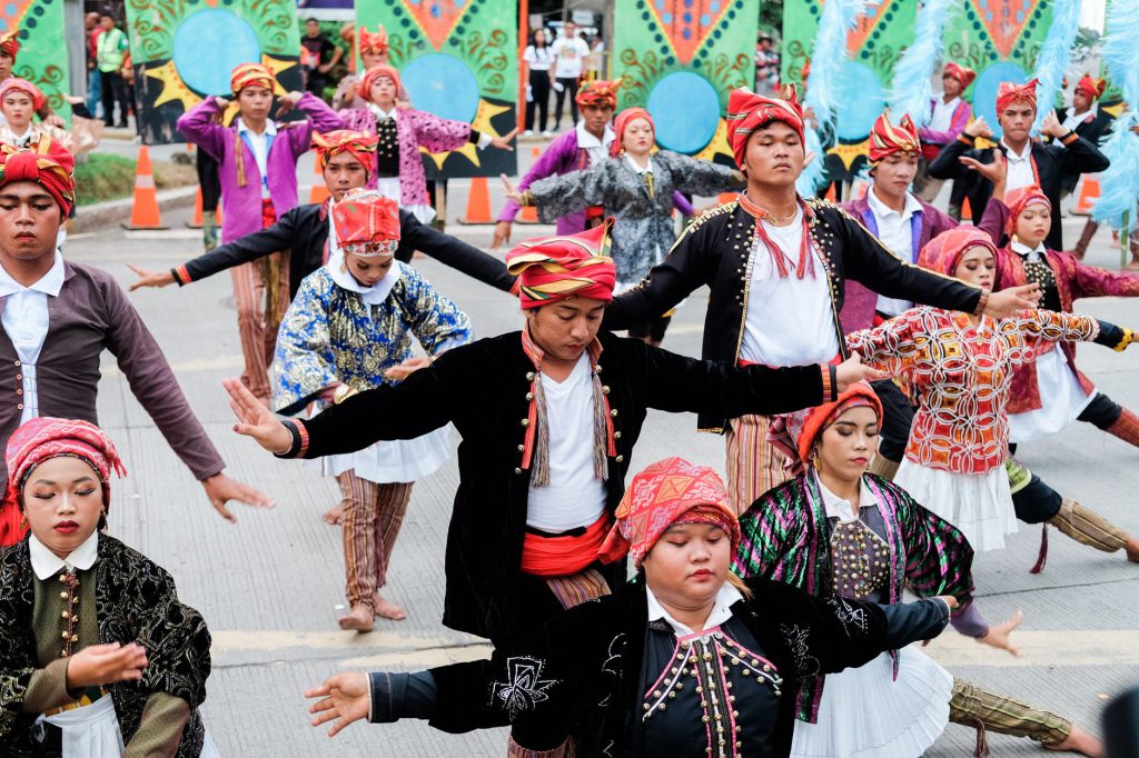 Colorful street performance showcasing traditional Filipino dance in Davao City, Philippines.